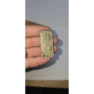 vintage Anson money clip, likely made of brass with a gold-tone finish.